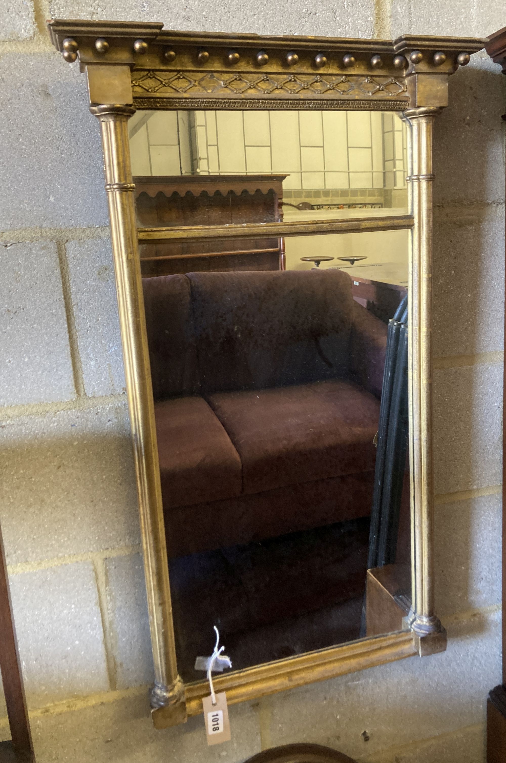 A 19th century rectangular gilt framed wall mirror, with pillar and ball shot frame, width 55cm, height 93cm